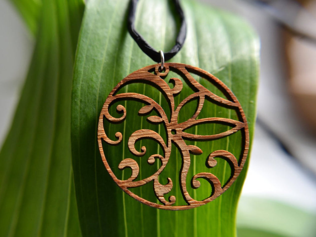 Floral Circle Pendant in cherry on leather cord